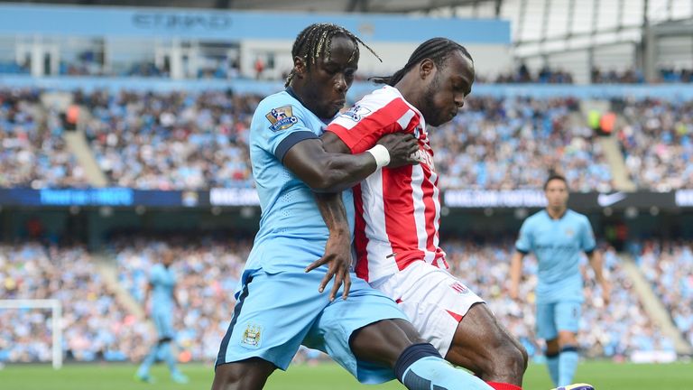 Manchester City defender Bacary Sagna challenges Stoke's Victor Moses