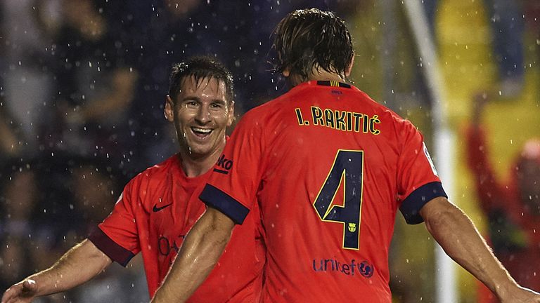 VALENCIA, SPAIN - SEPTEMBER 21:  Ivan Rakitic of Barcelona celebrates scoring with his teammate Lionel Messi during the La Liga match between Levante UD an