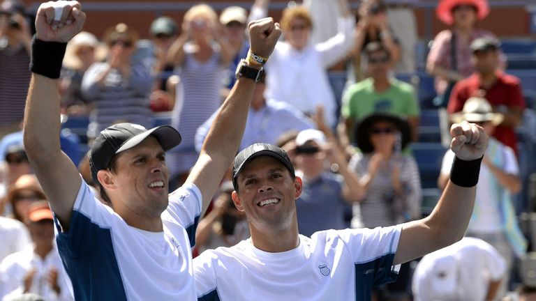 Bob (L) and Mike Bryan celebrate against Marcel Granollers and Marc Lopez after their US Open men's doubles final 2014