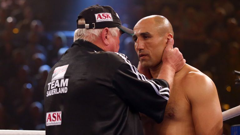 Arthur Abraham is given some instructions from his corner during his WBO super-middleweight title defence against Paul Smith in Germany