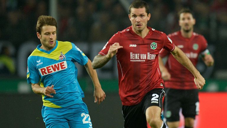 HANOVER, GERMANY - SEPTEMBER 24:  Leon Andreasen of Hannover and Daniel Halfar of Koeln 