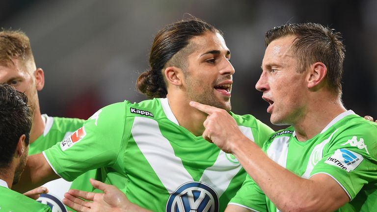 WOLFSBURG, GERMANY - SEPTEMBER 27:  Ivica Olic of Wolfsburg celebrates scoring the second goal with Ricardo Rodriguez and Vieirinha during the Bundesliga 