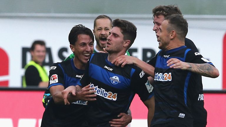 Moritz Stoppelkamp of Paderborn (2nd L) celebrates the second goal