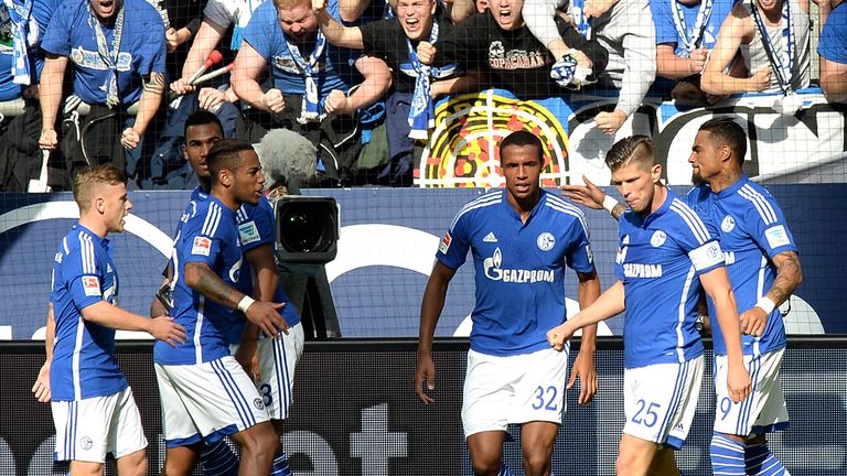 GELSENKIRCHEN, GERMANY - SEPTEMBER 27:  Joel Matip (C) of Schalke celebrates the opening goal with 