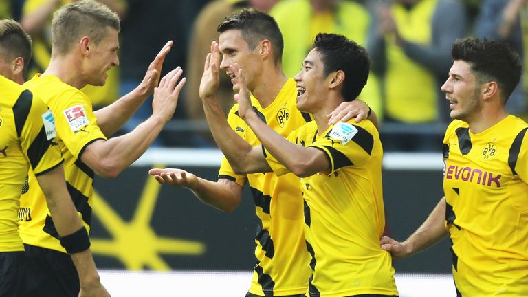 Shinji Kagawa of Borussia Dortmund celebrates after scoring against SC Freiburg 