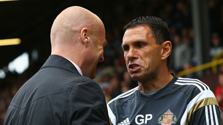 Burnley manager Sean Dyche chats to Gus Poyet 