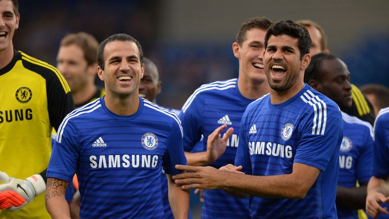 Chelsea's Cesc Fabregas and Diego Costa share a joke before a pre season friendly at Stamford Bridge, London.