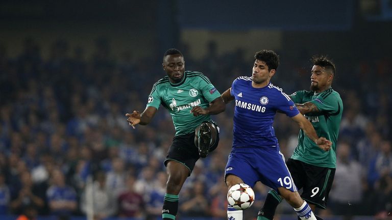 Chelsea striker Diego Costa vies with Schalke's Chinedu Obasi (L) and  Kevin Prince Boateng