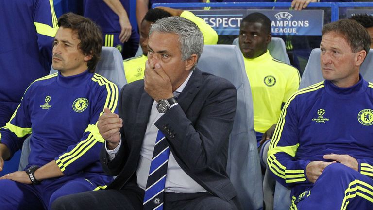 Chelsea's Portuguese manager Jose Mourinho (C) takes his seat ahead of the UEFA Champions League, group G football match between Chelsea and Schalke