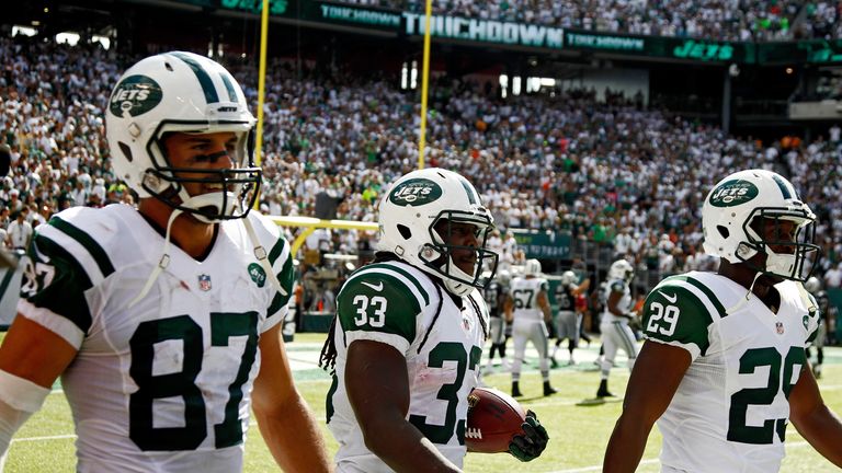 Chris Ivory (c) of the New York Jets walks back with Eric Decker (l) and Bilal Powell after his touchdown against Oakland Raiders