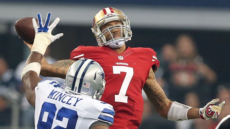 San Francisco 49ers quarterback Colin Kaepernick gets his pass away under pressure from Jeremy Mincey of the Dallas Cowboys 