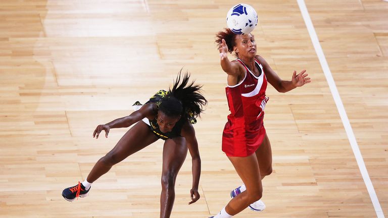 GLASGOW, SCOTLAND - AUGUST 03:  Serena Guthrie of England and Khadijah Williams of Jamaica battle for the ball during the Netball Bronze Medal Match betwee