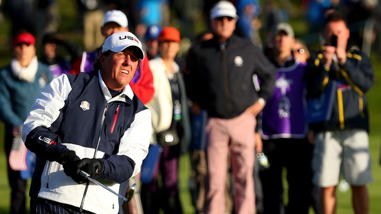 Phil Mickelson hits his approach to the 2nd hole