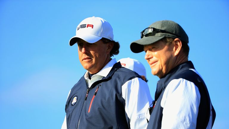 Phil Mickelson (L) of the United States talks with captain Tom Watson