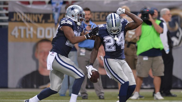 Morris Claiborne and J.J. Wilcox of the Dallas Cowboys celebrate the fourth quarter game clinching interception 
