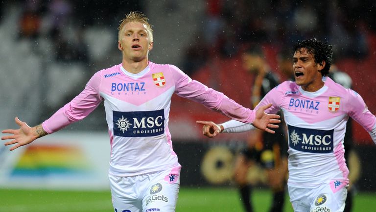 Evian's Danish midfielder Daniel Wass (L) celebrates after scoring during the French L1 football match between 