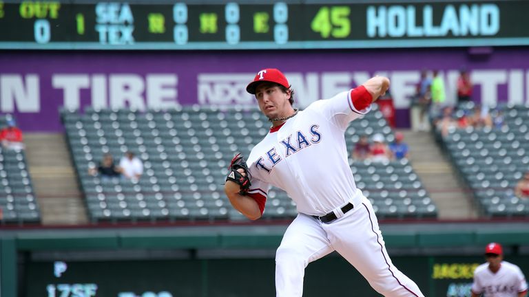 Derek Holland #45 of the Texas Rangers in throws in the first inning against the Seattle Mariners at Globe Life Park 