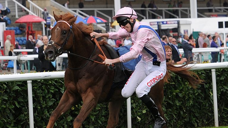 George Baker falls from Cotai Glory as they were about to win the Poypipe Flying Childers Stakes during day three of the 2014 Ladbrokes St Leger Festival a