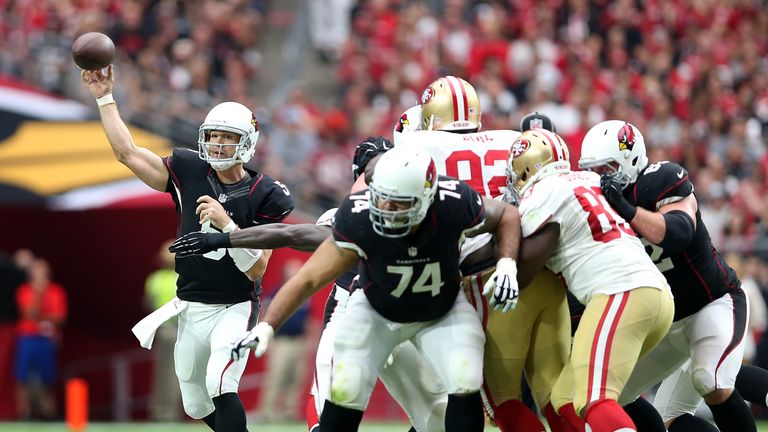 Quarterback Drew Stanton of the Arizona Cardinals passes under pressure from the San Francisco 49ers
