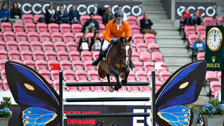 Netherlands' Jeroen Dubbeldam makes a jump on the horse Utascha SFN during the FEI Horse Jumping European Championships in Herning, Denmark on August 21, 2