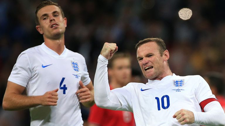 *Alternate Crop* England's Wayne Rooney celebrates scoring his side's first goal of the game from the penalty spot with teammate Jordan Henderson 