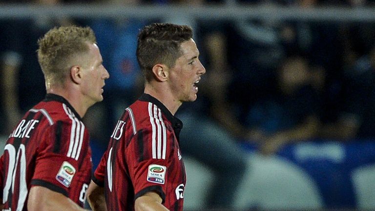 AC Milan's Spanish forward Fernando Torres (R) celebrates after scoring