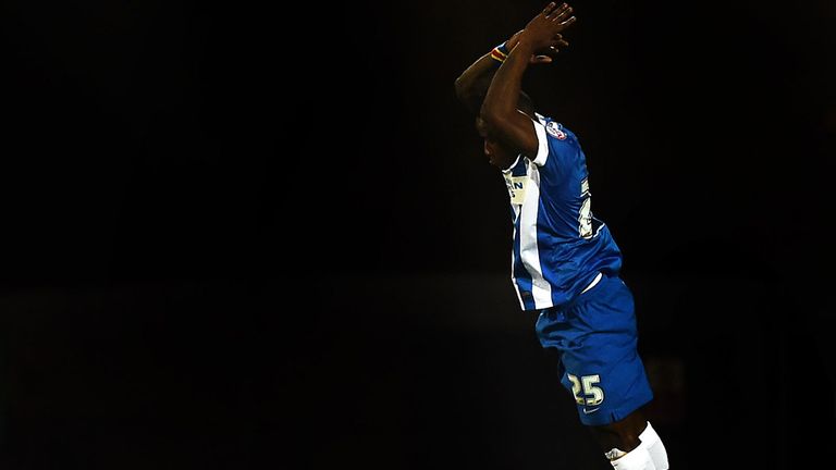 Kazenga Lua Lua of Brighton and Hove Albion jumps for joy as he scores the second goal at Burton