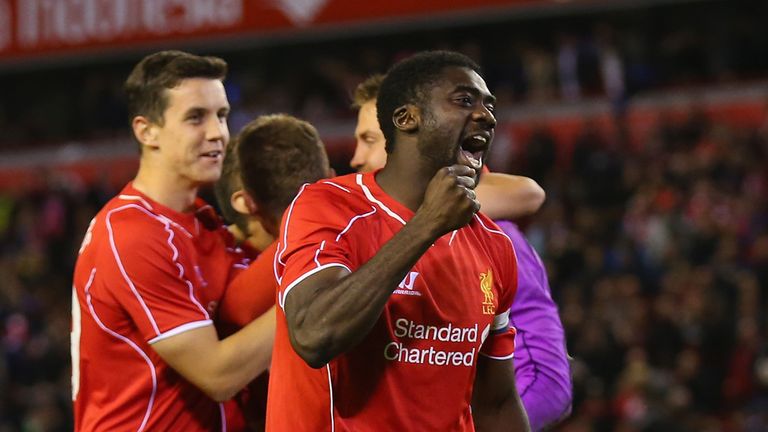 LIVERPOOL, ENGLAND - SEPTEMBER 23:  Kolo Toure of Liverpool celebrates after winning the match on penalties