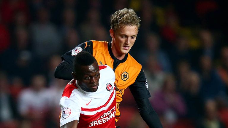Igor Vetokele of Charlton Athletic is challenged by George Saville of Wolverhampton Wanderers during the Sky Bet Champions