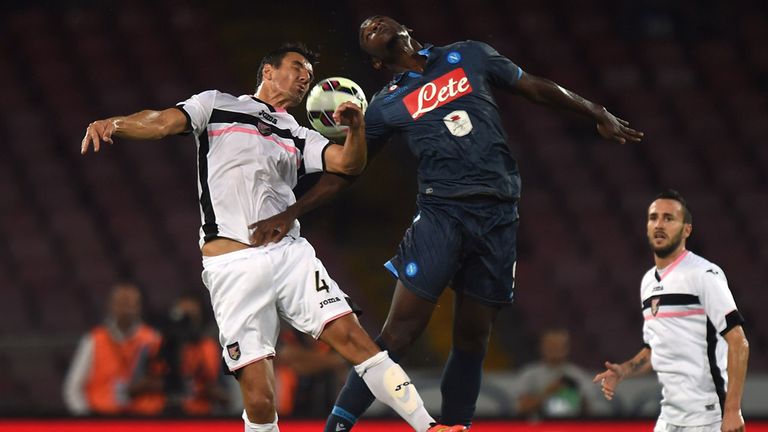 Sinisa Andelkovic (L) of Palermo and Duvan Esteban Zapata of Napoli jump for a header