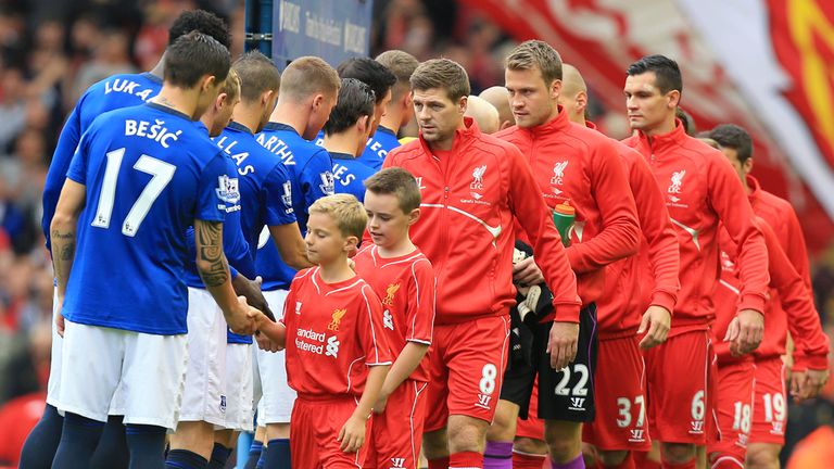 Liverpool and Everton fans shake hands prior to kick-off during the Barclays Premier League match at Anfield, Liverpool.