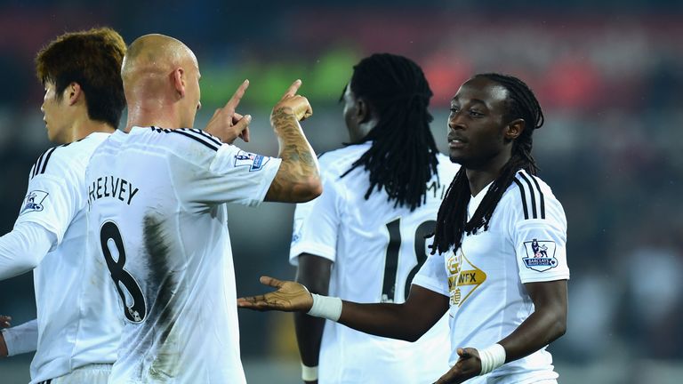 Swansea player Jonjo Shelvey (l) congratulates goalscorer Marvin Emnes on his goal during the Capital One Cup Third Round match against Everton