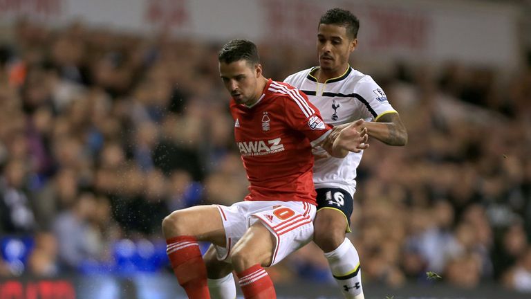 Nottingham Forest's Stephen McLaughlin and Tottenham Hotspur's Kyle Naughton battle for the ball during the Capital One Cup Third Round at White Hart Lane