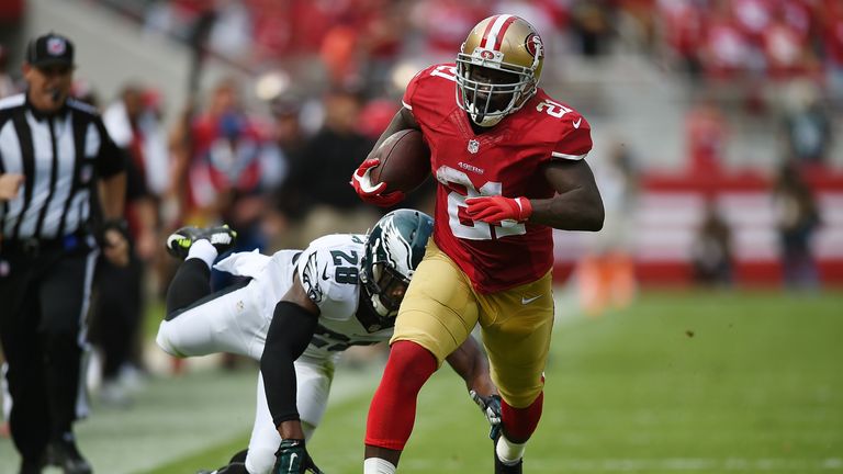 Frank Gore of the San Francisco 49ers runs with the football
