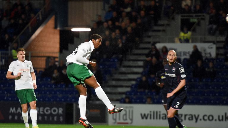 Hibernian's Dominique Molonga heads his side into the lead against Ross County. 