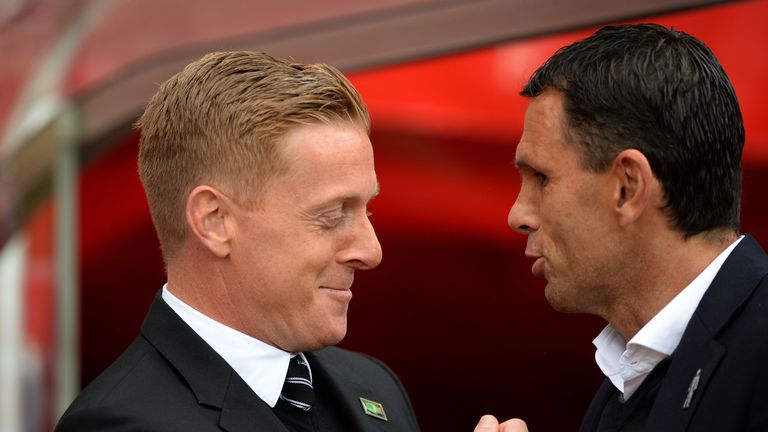 SUNDERLAND, ENGLAND - SEPTEMBER 27:  Garry Monk the managerof Swansea City and Gustavo Poyet the manager of Sunderland greet each other during the Barclays