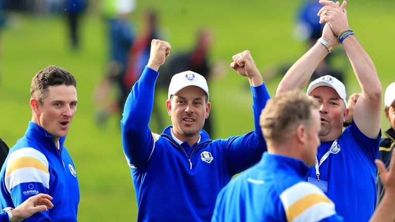 Justin Rose and Henrik Stenson, who formed a superb partnership over the first two days, join in the celebrations