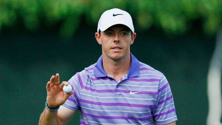 Rory McIlroy of Northern Ireland waves to the gallery on the 18th hole during the first round of the TOUR Championship