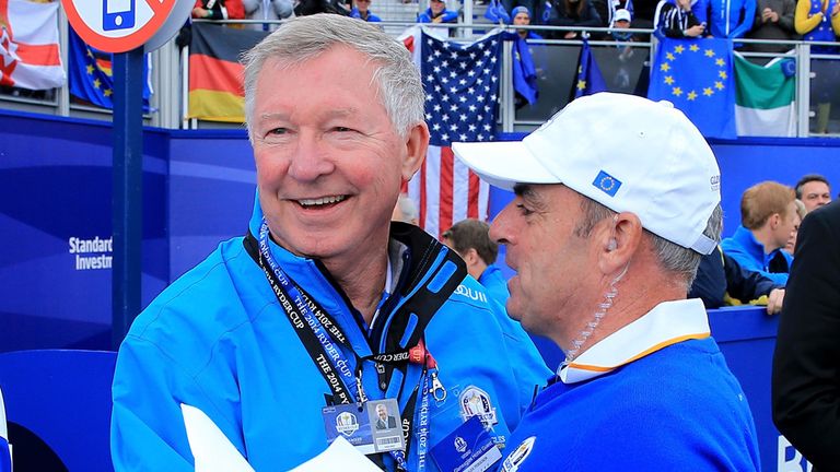 AUCHTERARDER, SCOTLAND - SEPTEMBER 28:  Europe team captain Paul McGinley embraces Sir Alex Ferguson on the 1st tee during the Singles Matches of the 2014 