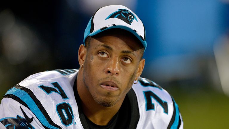 Greg Hardy of the Carolina Panthers watches from the bench during a loss to the Buffalo Bills