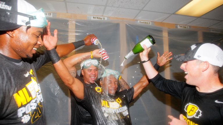 Gregory Polanco, Jose Tabata and Starling Marte of the Pittsburgh Pirates celebrate clinching a playoff place