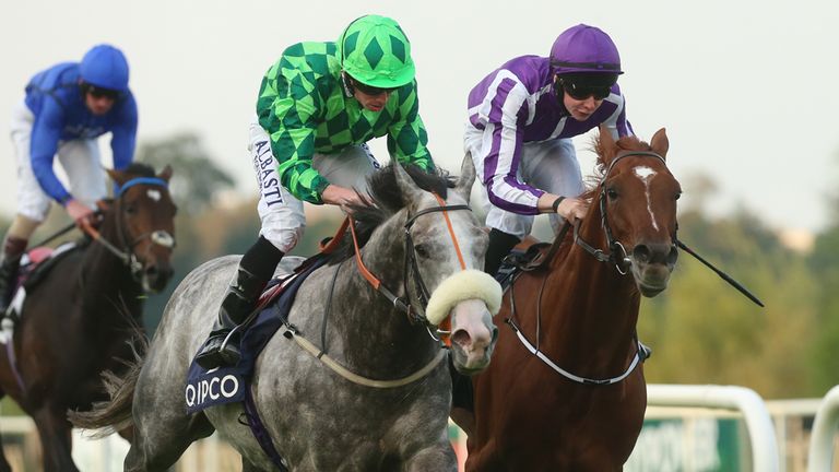 The Grey Gatsby ridden by Ryan Moore (centre) wins ahead of Australia, ridden by Joseph O'Brien (right) in The QIPCO Irish Champion Stakes during the Irish
