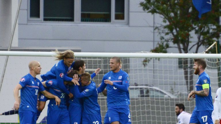 Iceland's players celebrate after forward Jon Dadi Bodvarsson (hidden) scored the 1-0 goal during the UEFA Euro 2016 Group A qualifier Iceland vs Turkey