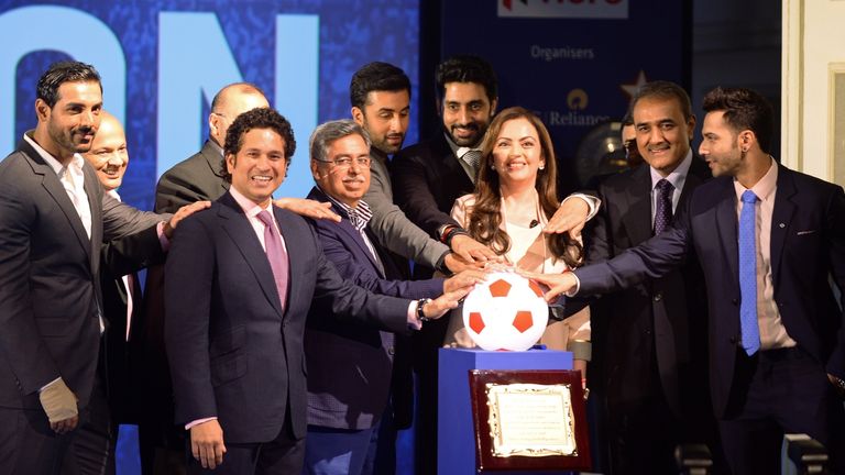 Nita Ambani (3rd R), director of Reliance Industries, poses with promoters and owners of football teams during the launch of the Indian Super League (ISL) 