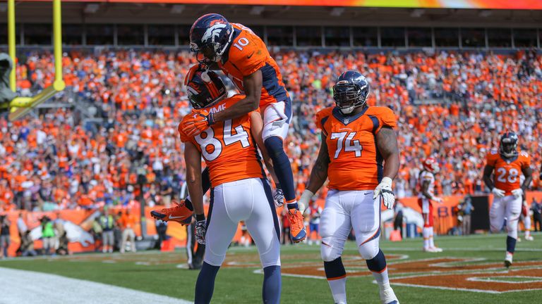 Tight end Jacob Tamme #84 of the Denver Broncos celebrates with wide receiver Emmanuel Sanders #10  against the Kansas City Chiefs