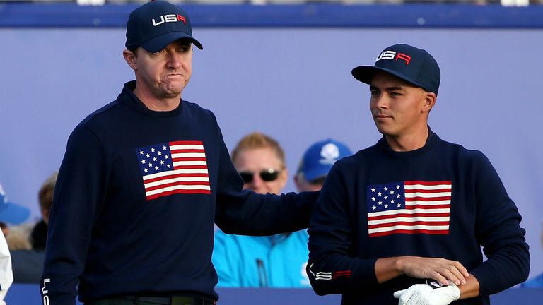 Jimmy Walker and Rickie Fowler take in the unique atmosphere before teeing off on the first hole