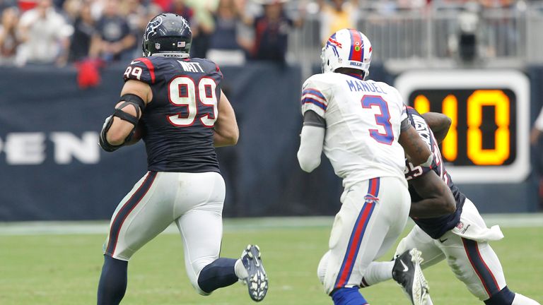 JJ Watt (#99) of the Houston Texans runs with the ball