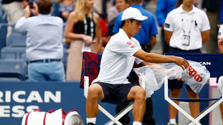 Kei Nishikori  sits down before playing in the US Open final