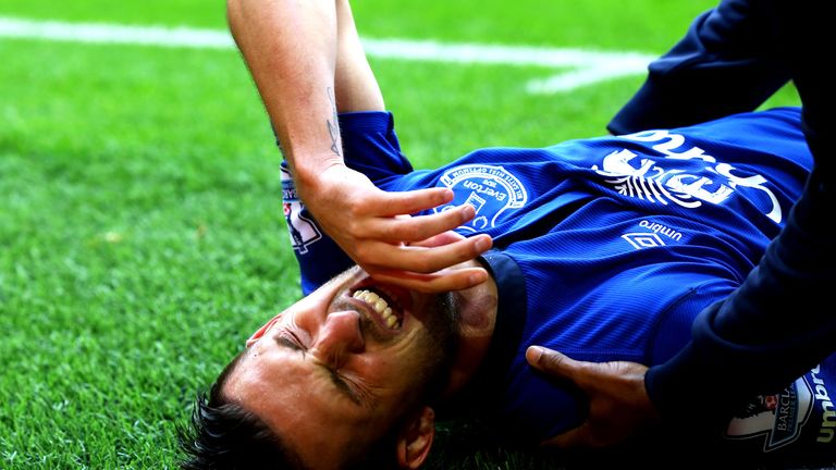 Kevin Mirallas of Everton pulls up with a hamstring injury during the match