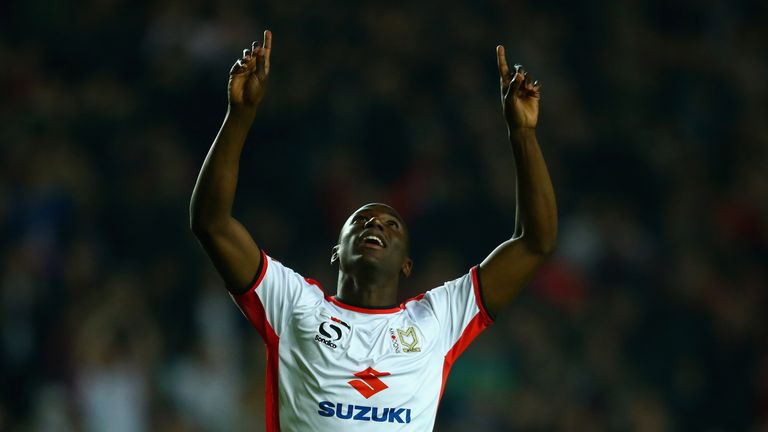 MILTON KEYNES, ENGLAND - SEPTEMBER 23:  Benik Afobe of MK Dons celebrates scoring the first goal during the Capital One Cup Third Round match between MK Do